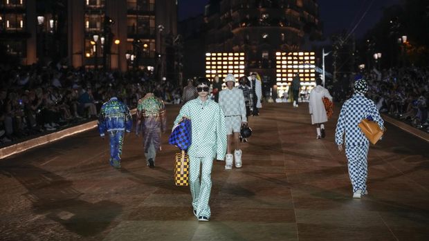 Models wear creations for Louis Vuitton as part of the Menswear Spring/Summer 2024 fashion collection presented in Paris, Tuesday, June 20, 2023. (AP Photo/Christophe Ena)