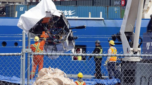 Debris from the Titan submersible, recovered from the ocean floor near the wreck of the Titanic, is unloaded from the ship Horizon Arctic at the Canadian Coast Guard pier in St. John's, Newfoundland, Wednesday, June 28, 2023. (Paul Daly/The Canadian Press via AP)
