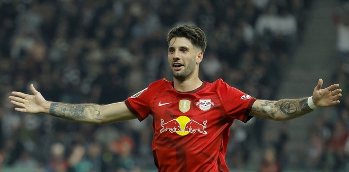 Leipzigs Hungarian midfielder Dominik Szoboszlai celebrates after scoring the 2-0 goal during the German Cup (DFB Pokal) final football match RB Leipzig v Eintracht Frankfurt in Berlin, Germany, on June 3, 2023. (Photo by Odd ANDERSEN / AFP) / DFB REGULATIONS PROHIBIT ANY USE OF PHOTOGRAPHS AS IMAGE SEQUENCES AND QUASI-VIDEO.
