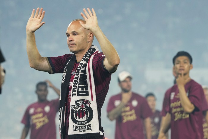 Vissel Kobe midfielder Andres Iniesta waves towards audience members at the end of a farewell ceremony to commemorate his leaving the club, after his last match with the club against Consadole Sapporo in Kobe, Japan, Saturday, July 1, 2023. (AP Photo/Hiro Komae)