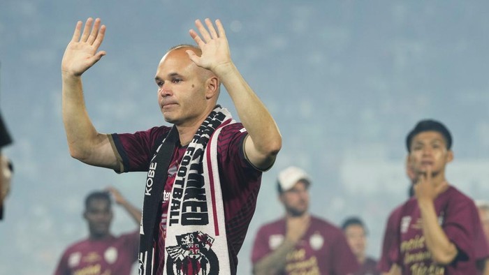 Vissel Kobe midfielder Andres Iniesta waves towards audience members at the end of a farewell ceremony to commemorate his leaving the club, after his last match with the club against Consadole Sapporo in Kobe, Japan, Saturday, July 1, 2023. (AP Photo/Hiro Komae)