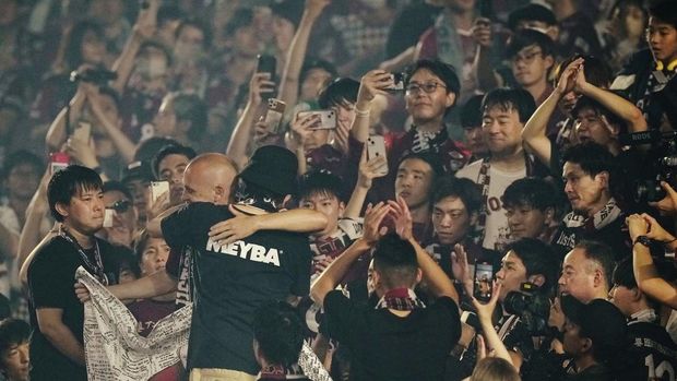 Vissel Kobe midfielder Andres Iniesta waves towards audience members at the end of a farewell ceremony to commemorate his leaving the club, after his last match with the club against Consadole Sapporo in Kobe, Japan, Saturday, July 1, 2023. (AP Photo/Hiro Komae)