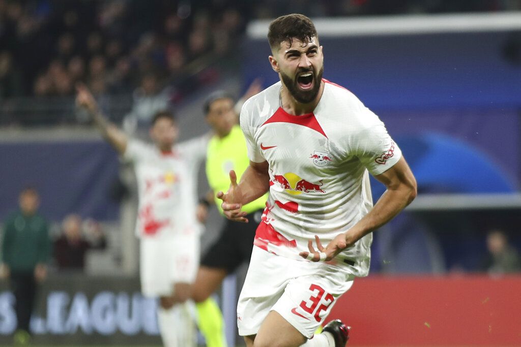 Leipzig's Josko Gvardiol celebrates after scoring his side's opening goal during the UEFA Champions League round of sixteen first leg soccer match between RB Leipzig and Manchester City in Leipzig, Germany, Wednesday, Feb. 22, 2023. (AP Photo/Andreas Gora)
