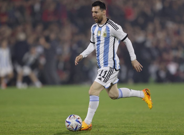 Lionel Messi controls the ball during Argentine soccer player Maximiliano Rodriguez's farewell match at the Marcelo Bielsa stadium in Rosario, Argentina, Saturday, June 24, 2023.(AP Photo/Nicolas Aguilera)