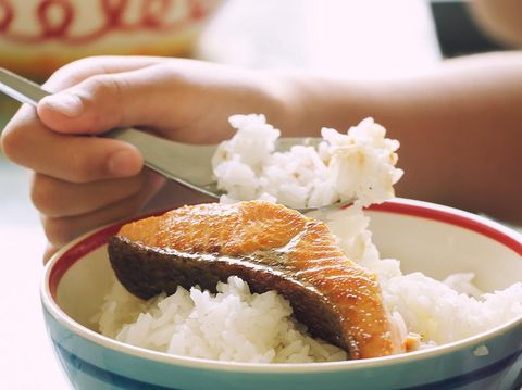 Kid Eating Grill Salmon with Rice