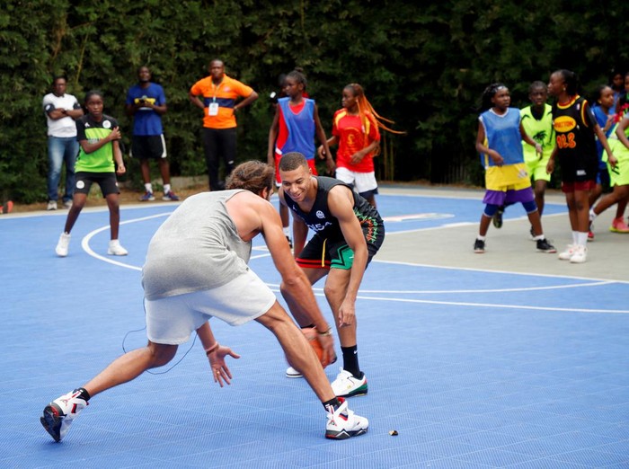 French international soccer star Kylian Mbappe plays a basketball game at the village Noah while he continues his first visit to his father's homeland, in Yaounde, Cameroon, July 7, 2023. REUTERS/Desire Danga Essigue