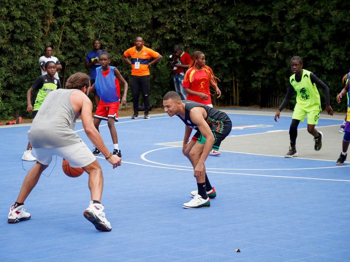 French international soccer star Kylian Mbappe plays a basketball game at the village Noah while he continues his first visit to his father's homeland, in Yaounde, Cameroon, July 7, 2023. REUTERS/Desire Danga Essigue