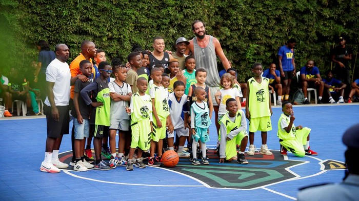 French international soccer star Kylian Mbappe poses with fans after a basketball game at the village Noah, while he continues his first visit to his father's homeland, in Yaounde, Cameroon, July 7, 2023. REUTERS/Desire Danga Essigue     TPX IMAGES OF THE DAY