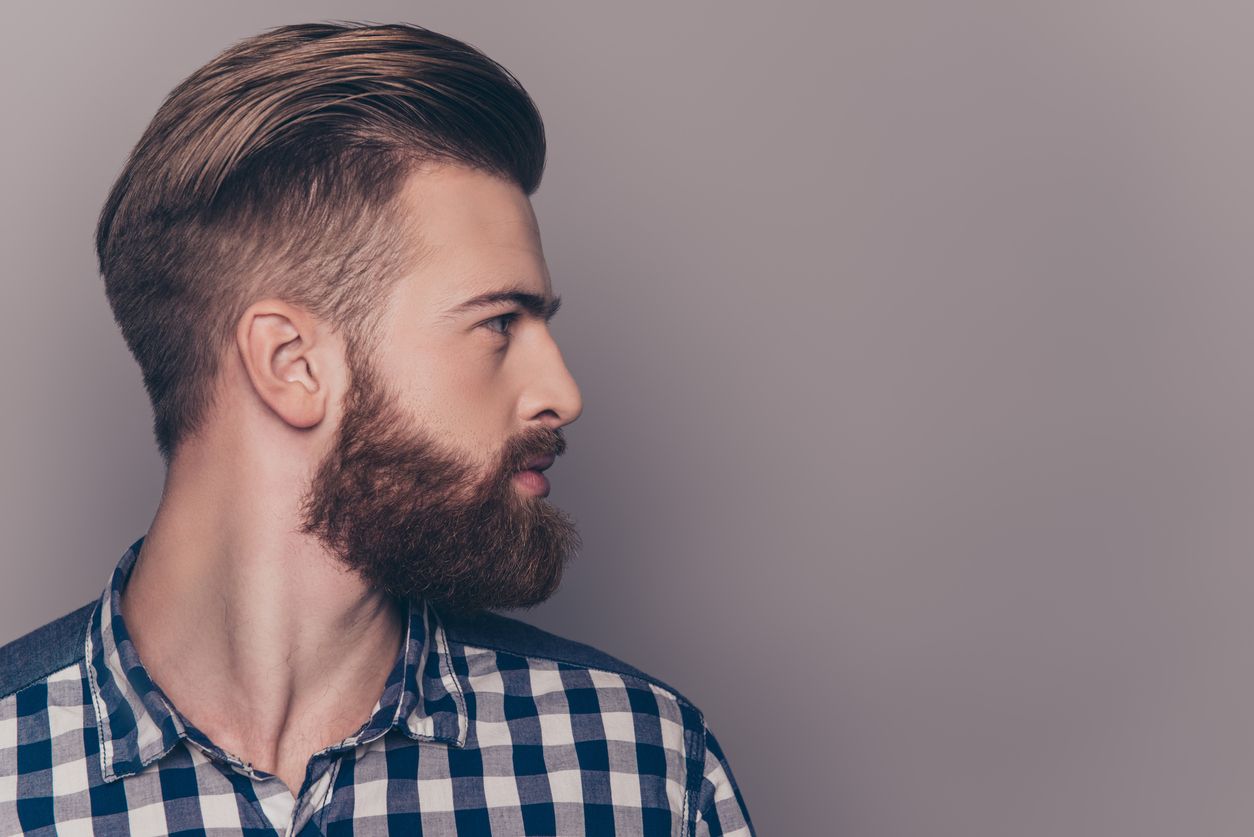 Side view portrait of thinking stylish young man looking away