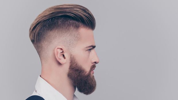 Half-faced portrait of serious concentrated confident brutal chic handsome attractive classy modern guy wearing classic white shirt suspenders isolated on gray background copyspace empty blank