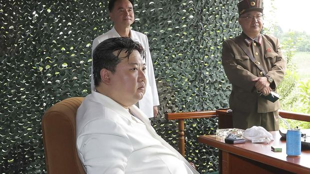 In this photo provided on July 13, 2023, by the North Korean government, North Korean leader Kim Jong Un watches what North Korea says is the test-firing of an Hwasong-18 ICBM, at an undisclosed location, in North Korea, on July 12, 2023. Independent journalists were not given access to cover the event depicted in this image distributed by the North Korean government. The content of this image is as provided and cannot be independently verified. Korean language watermark on image as provided by source reads: 
