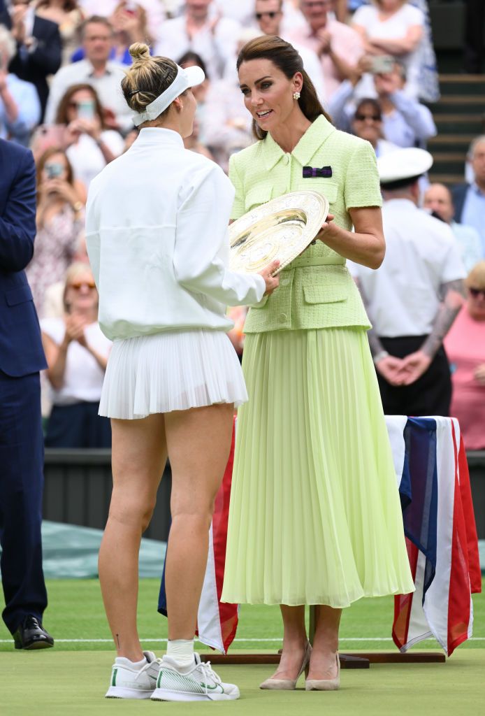LONDON, ENGLAND - JULY 15: Catherine, Princess of Wales gives the Venus Rosewater Dish trophy to Marketa Vondrousova of Czech Republic after winning the Women's Single Final Match against Ons Jabeur of Tunisia during day thirteen of the Wimbledon Tennis Championships at All England Lawn Tennis and Croquet Club on July 15, 2023 in London, England. (Photo by Karwai Tang/WireImage)