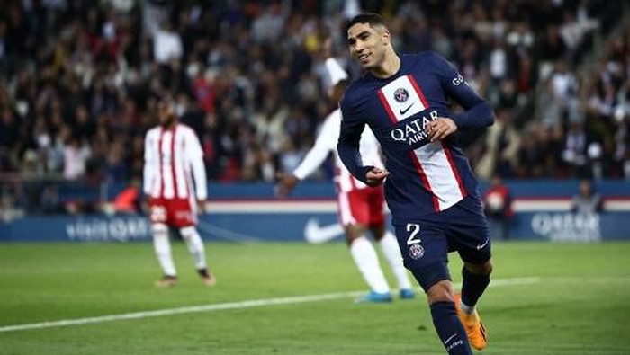 Paris Saint-Germains Moroccan defender Achraf Hakimi celebrates after scoring a goal during the French L1 football match between Paris Saint-Germain (PSG) and Ajaccio at the Parc des Princes in Paris, on May 13, 2023. (Photo by Anne-Christine POUJOULAT / AFP)