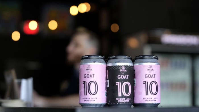Beer brewed by the Prison Pals Brewery, labeled GOAT 10 in honor of Argentine soccer star Lionel Messi, is shown at the Prison Pals Taproom, Tuesday, July 11, 2023, in Doral, Fla. Murals, burgers, beers, and billboards are just a handful of examples that show the euphoria that Messi generates in South Florida and how he will be received. (AP Photo/Lynne Sladky)