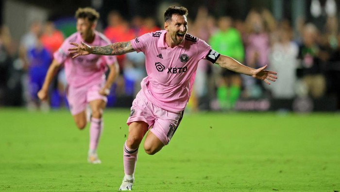 Jul 21, 2023; Fort Lauderdale, FL, USA; Inter Miami CF forward Lionel Messi (10) scores a goal past Cruz Azul goalkeeper Andres Gudiño (30) during the second half at DRV PNK Stadium. Mandatory Credit: Nathan Ray Seebeck-USA TODAY Sports