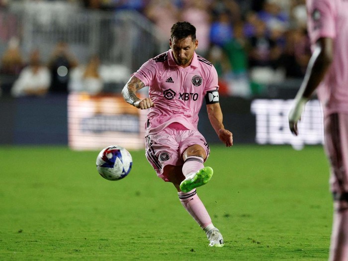 Jul 21, 2023; Fort Lauderdale, FL, USA; Inter Miami CF forward Lionel Messi (10) scores a goal past Cruz Azul goalkeeper Andres Gudiño (30) during the second half at DRV PNK Stadium. Mandatory Credit: Nathan Ray Seebeck-USA TODAY Sports