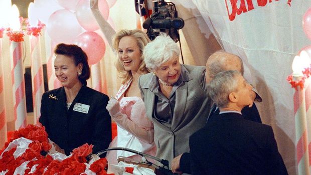 Ruth Handler A Barbie model (2nd L) waves after the opening bell was rung 09 March 1999 at the New York Stock Exchange. The ceremony was to commemorate the 40th anniversary of the Mattel, Inc. doll as the company sponsored