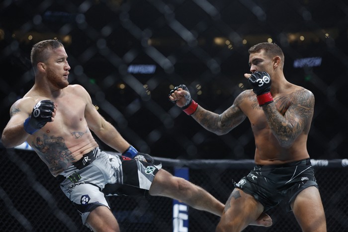 Jul 29, 2023; Salt Lake City, Utah, USA; Dustin Poirier (red gloves) fights Justin Gaethje (blue gloves) during UFC 291 at Delta Center. Mandatory Credit: Jeff Swinger-USA TODAY Sports