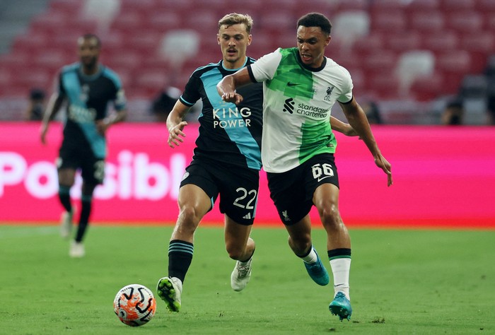 Soccer Football - Pre-Season Friendly - Liverpool v Leicester City - National Stadium, Kallang, Singapore - July 30, 2023 Liverpools Trent Alexander-Arnold in action with Leicester Citys Kiernan Dewsbury-Hall REUTERS/Edgar Su