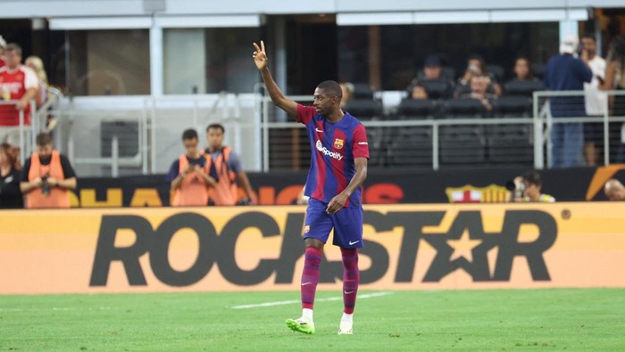 Jul 29, 2023; Arlington, Texas, USA;  FC Barcelona forward Ousmane Dembele (7) reacts after scoring a goal during the first half against Real Madrid at AT&T Stadium. Mandatory Credit: Kevin Jairaj-USA TODAY Sports
