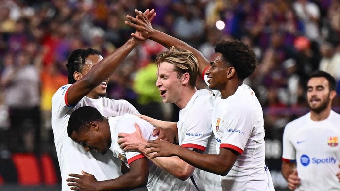 Barcelonas Spanish forward Ansu Fati (2nd L) celebrates scoring his teams first goal with teammates during a pre-season friendly football match between AC Milan and FC Barcelona, at Allegiant Stadium in Las Vegas, Nevada, on August 1, 2023. (Photo by Patrick T. Fallon / AFP)