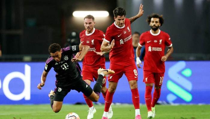 Liverpool vs Bayern Soccer Football - Friendly - Liverpool v Bayern Munich - Singapore National Stadium, Singapore, Singapore - August 2, 2023 Bayern Munich's Jamal Musiala in action with Liverpool's Dominik Szoboszlai REUTERS/Edgar Su