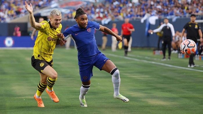 Aug 2, 2023; Chicago, Illinois, USA; Borussia Dortmund defender Julian Ryerson (26) battles for the ball against Chelsea forward Christopher Nkunku (45) during the first half at Soldier Field. Mandatory Credit: Jon Durr-USA TODAY Sports