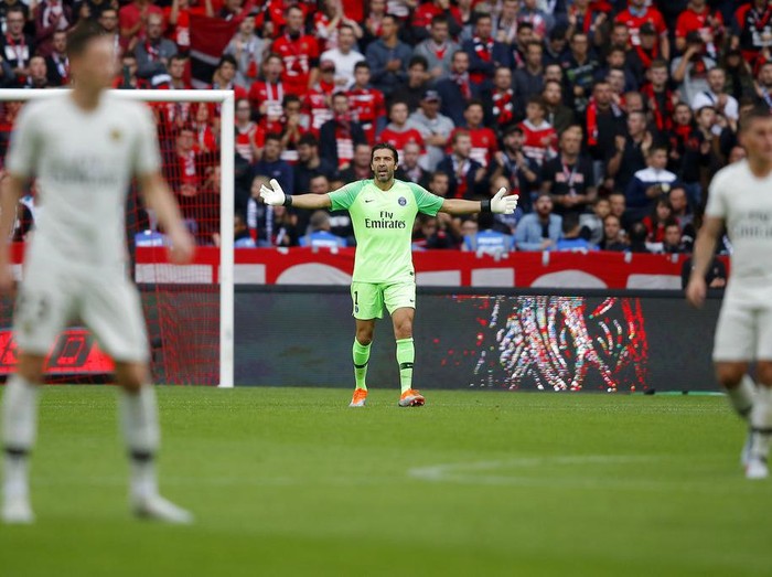 PSG's goalkeeper Gianluigi Buffon gestures during their French League One soccer match between Rennes and Paris-Saint-Germain at Roazhon Park stadium in Rennes, western France, Sunday, Sept. 23, 2018. (AP Photo/Michel Euler)