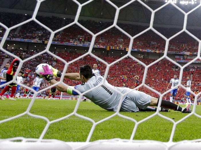 Italy's goalkeeper Gianluigi Buffon deflects the ball during the Euro 2016 Group E soccer match between Belgium and Italy at the Grand Stade in Decines-Charpieu, near Lyon, France, Monday, June 13, 2016. (AP Photo/Antonio Calanni)
