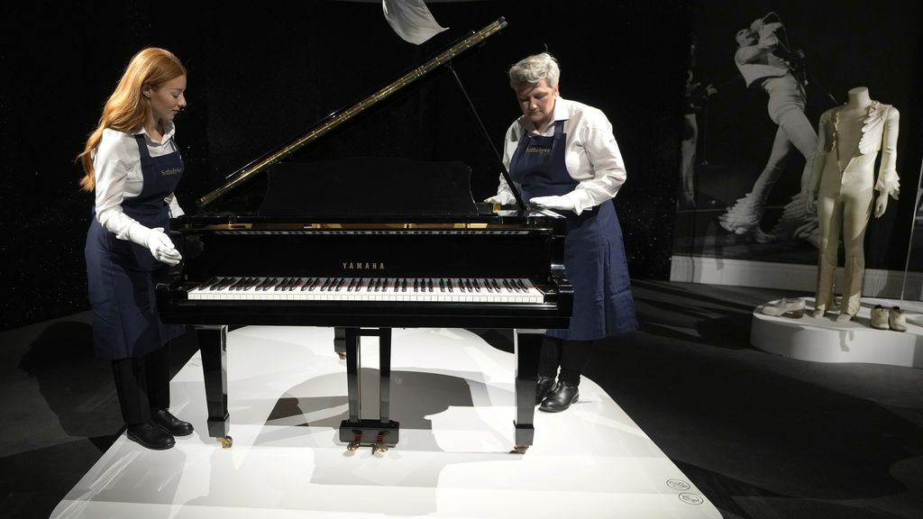 Freddie Mercury's Yamaha Grand Piano, estimated at 2-3 million pounds, on display at Sotheby's auction rooms in London, Thursday, Aug. 3, 2023. More than 1,000 of Freddie Mercury's personal items, including his flamboyant stage costumes, handwritten drafts of “Bohemian Rhapsody” and the baby grand piano he used to compose Queen's greatest hits, are going on show in an exhibition at Sotheby's London ahead of their sale. (AP Photo/Kirsty Wigglesworth)