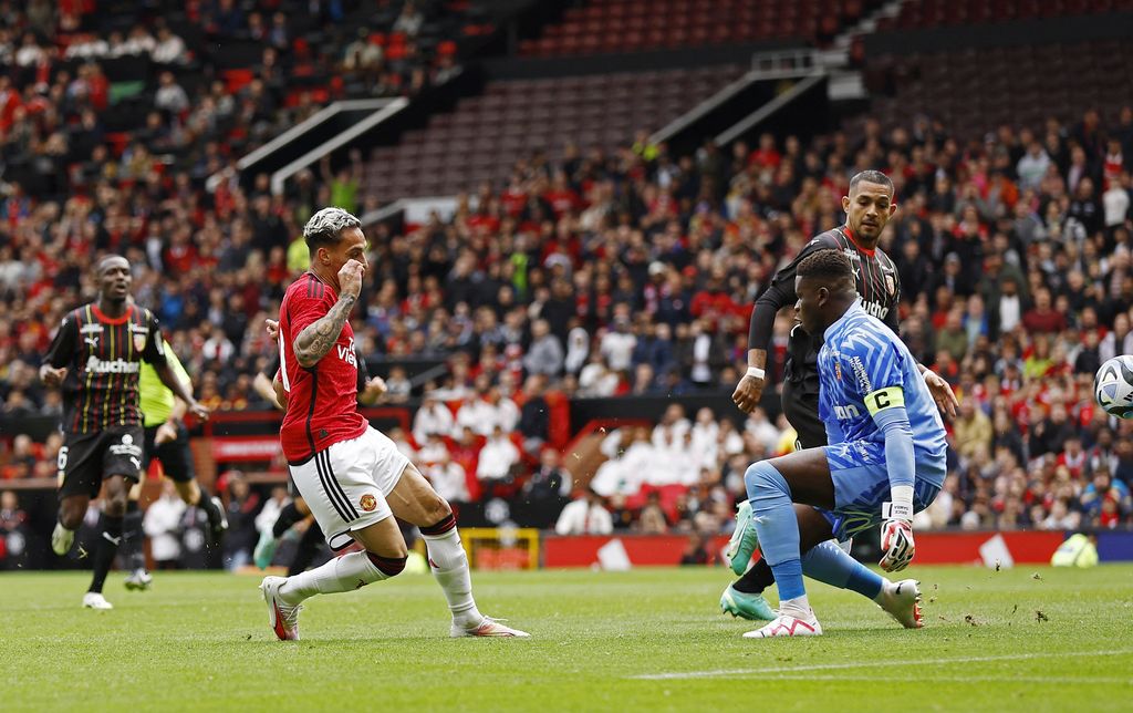 Soccer Football - Pre Season Friendly - Manchester United v RC Lens - Old Trafford, Manchester, Britain - August 5, 2023  Manchester United's Antony celebrates scoring their second goal with teammates Action Images via Reuters/Jason Cairnduff