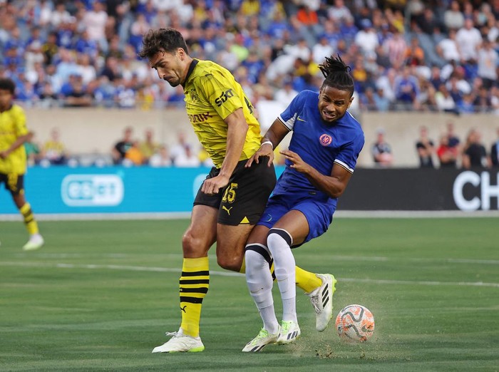 Aug 2, 2023; Chicago, Illinois, USA; Borussia Dortmund defender Mats Hummels (15) battles for the ball against Chelsea forward Christopher Nkunku (45) during the first half at Soldier Field. Mandatory Credit: Jon Durr-USA TODAY Sports