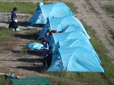 BUAN, SOUTH KOREA - AUGUST 08: Scouts prepare to leave the campsite of the World Scout Jamboree on August 08, 2023 in Buan, South Korea. Scouts and volunteers began leaving Saemangeum, the venue of the 25th World Scout Jamboree, days ahead of schedule, due to an approaching typhoon. (Photo by Chung Sung-Jun/Getty Images)