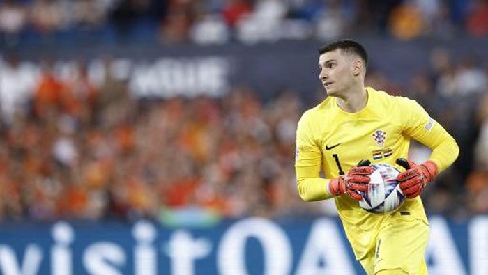 Croatia's goalkeeper Dominik Livakovic collects the ball during the UEFA Nations League semi final football match between The Netherlands and Croatia at the De Kuip Stadium in Rotterdam on June 14, 2023. (Photo by KENZO TRIBOUILLARD / AFP)