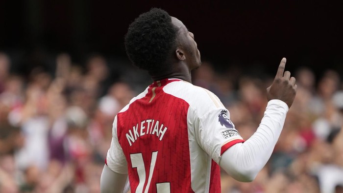 Arsenals Eddie Nketiah celebrates after scoring during the English Premier League soccer match between Arsenal and Nottingham Forest at Emirates stadium in London, Saturday, Aug. 12, 2023. (AP Photo/Kirsty Wigglesworth)