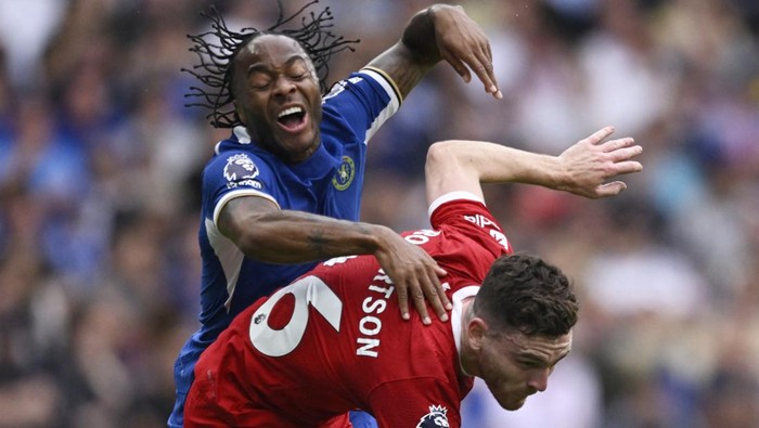 Soccer Football - Premier League - Chelsea v Liverpool - Stamford Bridge, London, Britain - August 13, 2023 Liverpools Andrew Robertson in action with Chelseas Raheem Sterling REUTERS/Tony Obrien EDITORIAL USE ONLY. No use with unauthorized audio, video, data, fixture lists, club/league logos or live services. Online in-match use limited to 75 images, no video emulation. No use in betting, games or single club /league/player publications.  Please contact your account representative for further details.
