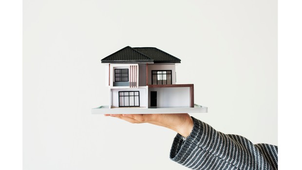 Potret ilustrasi miniatur rumah.