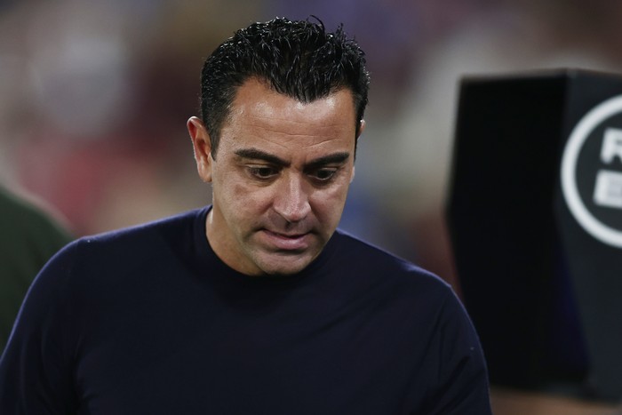 Barcelonas head coach Xavi Hernandez walks before the Spanish La Liga soccer match between Getafe and FC Barcelona at the Coliseum Alfonso Perez stadium in Getafe, Spain, Sunday, Aug. 13, 2023. (AP Photo/Alvaro Medranda)