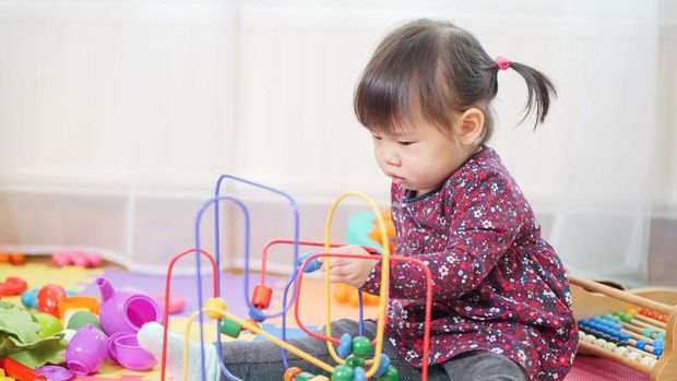 baby girl play toy at home