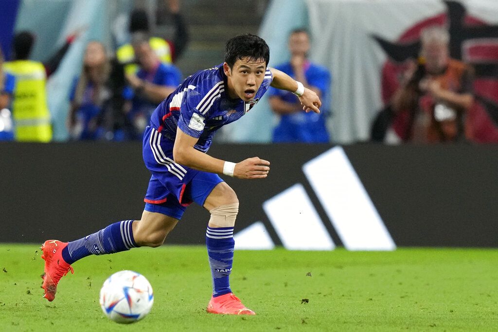 Japan's Wataru Endo looks the ball during the World Cup round of 16 soccer match between Japan and Croatia at the Al Janoub Stadium in Al Wakrah, Qatar, Monday, Dec. 5, 2022. (AP Photo/Eugene Hoshiko)