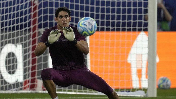 Sevillas goalkeeper Yassine Bounou makes a save during a training session at the Georgios Karaiskakis stadium in Piraeus port, near Athens, Greece, Tuesday, Aug. 15, 2023. Europa League holders Sevilla will meet Champions League winners Manchester City in the UEFA Super Cup on Wednesday, Aug. 16. (AP Photo/Thanassis Stavrakis)