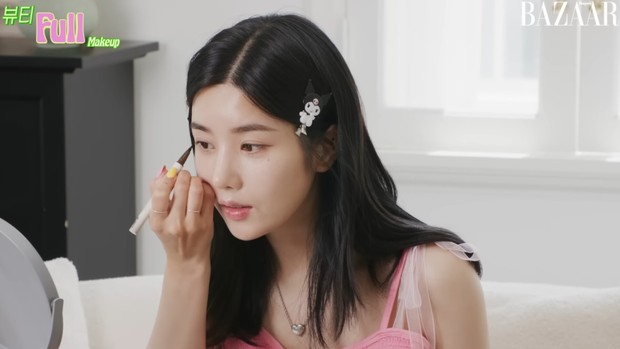 Portrait of Kwon Eun Bi putting on makeup in a photoshoot with Harper's BAZAAR