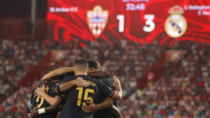 Real Madrid players celibrate after Vinicius Junior scored his sides third goal during a Spanish La Liga soccer match between Almeria and Real Madrid at the Power Horse Stadium in Almeria, Spain, Saturday, Aug. 19, 2023. (AP Photo/Fermin Rodriguez)