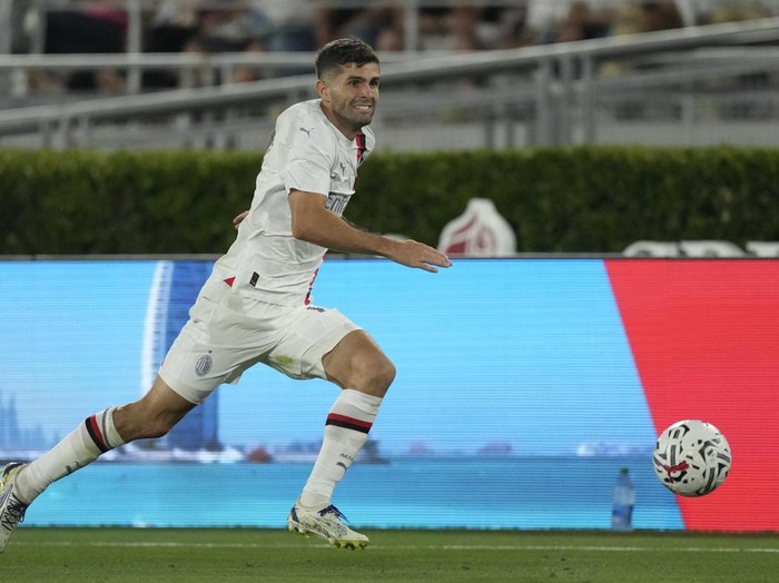 AC Milan forward Christian Pulisic (11) runs after the ball during a Soccer Champions Tour exhibition match against Real Madrid FC, Sunday, July 23, 2023, in Pasadena, Calif. (AP Photo/Ashley Landis)