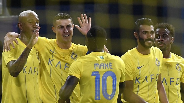 Nassrs Brazilian forward #94 Talisca (L) celebrates his goal during the AFC Champions League playoff football match between Saudis Al-Nassr and UAEs Shabab Al-Ahli at the King Saud University Stadium in Riyadh on August 22, 2023. (Photo by Yazid al-Duwihi / AFP)