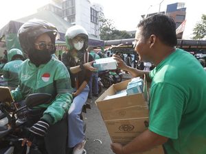 Grab Bagikan 125 Ribu Masker untuk Pengemudi dan Penumpang