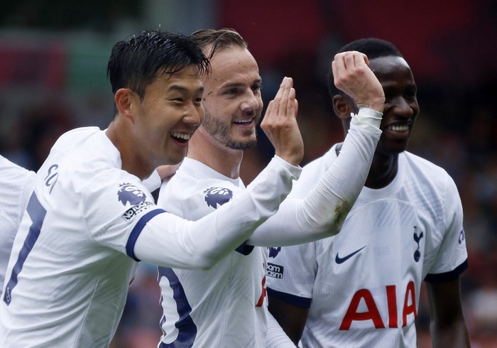 Bournemouth vs Tottenham Soccer Football - Premier League - AFC Bournemouth v Tottenham Hotspur - Vitality Stadium, Bournemouth, Britain - August 26, 2023 Tottenham Hotspur's James Maddison celebrates scoring their first goal with Son Heung-min and Pape Matar Sarr Action Images via Reuters/John Sibley EDITORIAL USE ONLY. No use with unauthorized audio, video, data, fixture lists, club/league logos or 'live' services. Online in-match use limited to 75 images, no video emulation. No use in betting, games or single club /league/player publications. Please contact your account representative for further details.