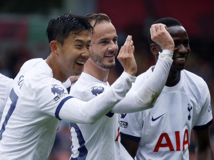 Soccer Football - Premier League - AFC Bournemouth v Tottenham Hotspur - Vitality Stadium, Bournemouth, Britain - August 26, 2023 Tottenham Hotspur's James Maddison celebrates scoring their first goal with Son Heung-min and Pape Matar Sarr Action Images via Reuters/John Sibley EDITORIAL USE ONLY. No use with unauthorized audio, video, data, fixture lists, club/league logos or 'live' services. Online in-match use limited to 75 images, no video emulation. No use in betting, games or single club /league/player publications.  Please contact your account representative for further details.