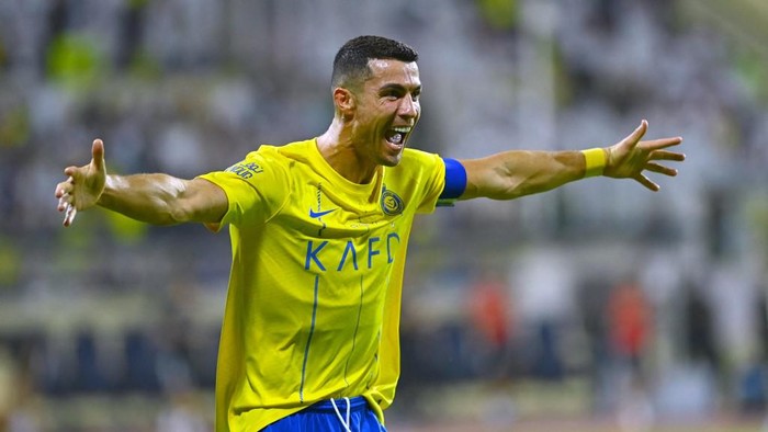 Nassrs Portuguese forward #07 Cristiano Ronaldo celebrates after scoring during the Saudi Pro League football match between Al-Nassr and Al-Fateh at the Prince Abdullah Bin Jalawi Stadium in al-Hasa, on August 25, 2023. (Photo by Ali Al-HAJI / AFP)