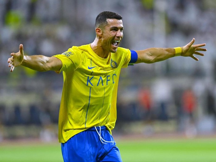 Nassr's Portuguese forward #07 Cristiano Ronaldo celebrates after scoring during the Saudi Pro League football match between Al-Nassr and Al-Fateh at the Prince Abdullah Bin Jalawi Stadium in al-Hasa, on August 25, 2023. (Photo by Ali Al-HAJI / AFP)